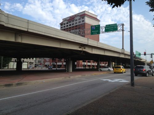 Plans call for altering the vehicular & pedestrian flow under the elevated highway at the NW corner of the Arch grounds. but it'll remain a divider. 