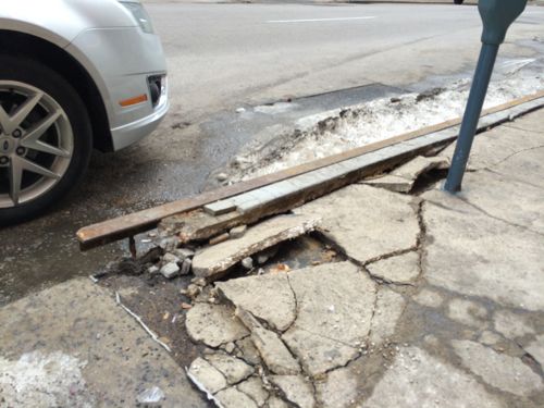This metal-edged curb ob 10th Street is a hazard. 